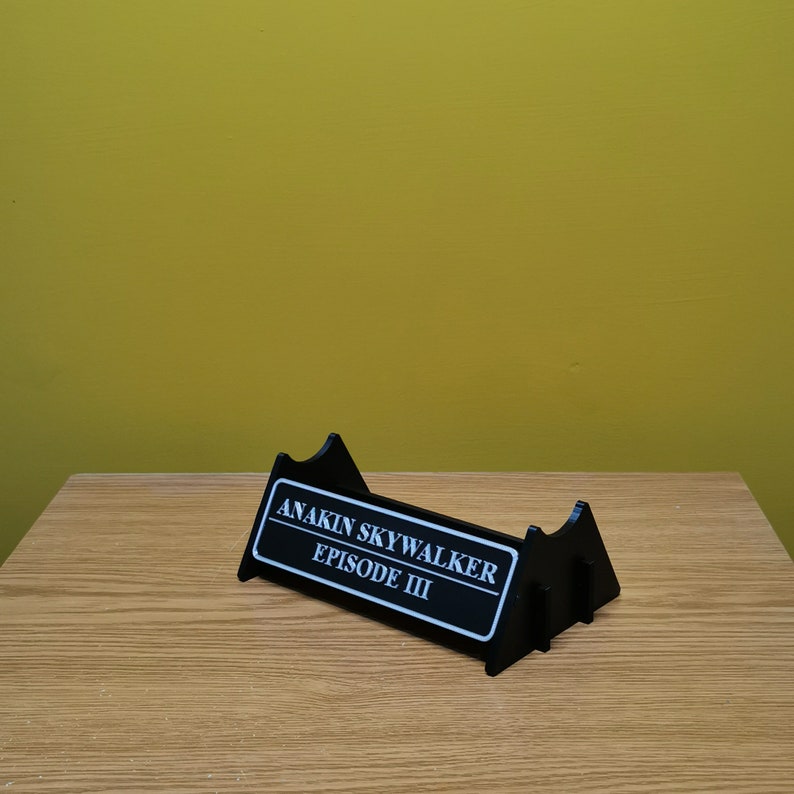 May include: Black plastic display stand with a white label that reads "ANAKIN SKYWALKER EPISODE III".