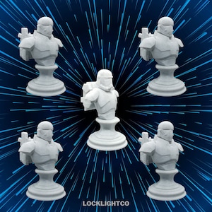 May include: Five white 3D printed busts of a Star Wars character wearing a helmet and armor. The busts are on white bases and are arranged in a circle on a blue background with white lines radiating outward.