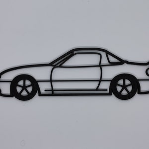 May include: A black line drawing of a sports car with a hardtop roof. The car is viewed from the side and has a simple design.