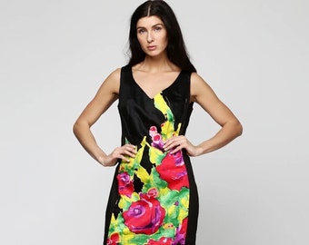 Ukrainian women's cotton summer dress in black with floral print. The dress has a fitted silhouette and a V-neck with a zipper on the side.