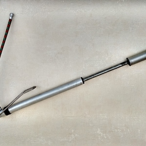 Vintage hand pump for USSR bicycle with hose and footrest.