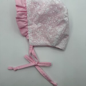 pink and white eyelet bonnet