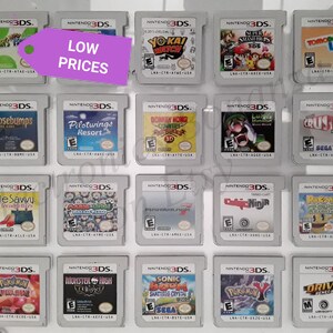 May include: A collection of 16 Nintendo 3DS game cartridges displayed on a shelf. The cartridges are arranged in four rows of four. The cartridges are all in their original cases and are in good condition. The cartridges include games such as "Yo-Kai Watch", "Super Smash Bros. 3DS", "Tomodachi Life", "Goosebumps", "Pilotwings Resort", "Luigi's Mansion: Dark Moon", "Crush 3D", "Style Savvy: Trendsetters", "Mario & Luigi: Dream Team Bros.", "Professor Layton and the Azran Legacy", "Code Ninja", "Pokemon Mystery Dungeon: Gates to Infinity", "Monster High 13 Wishes", "Sonic Boom: Shattered Crystal", "Pokemon Y", and "Driver: Renegade 3D".