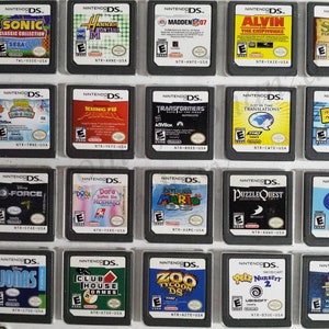 May include: A collection of 18 Nintendo DS game cartridges, displayed in a clear plastic case. The cartridges feature a variety of popular titles, including Sonic Classic Collection, Hannah Montana, Madden 07, Alvin and the Chipmunks, Shrek Forever After, Kung Fu Panda, Transformers,  Little Big Planet, Boogie, G-Force, Dora Saves the Mermaids, Super Mario DS, Puzzle Quest, Pet Shop, Jonas, Club House Games, Zoo Tycoon DS, Petz Nursery 2, and Are You Smarter Than a 5th Grader? Back to School.