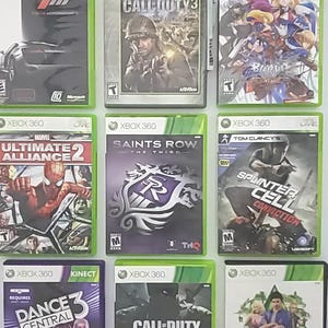 May include: Nine Xbox 360 video game cases are shown. Titles include "Forza Motorsport 4", "Call of Duty 3", "Marvel Ultimate Alliance 2", "Saints Row The Third", "Tom Clancy's Splinter Cell Conviction", "Dance Central 3", "Call of Duty Black Ops", and "The Sims 3".