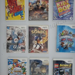 May include: A collection of ten video games for the Nintendo Wii console. The games include Just Dance Kids 2, Lego Lord of the Rings, Kidz Bop Dance Party, Madden NFL 13, Sonic and the Secret Rings, Skylanders Trap Team, Club Penguin Game Day, Monster Hunter 3, Lego Batman 2 DC Super Heroes, and a game with a blue penguin on the cover.