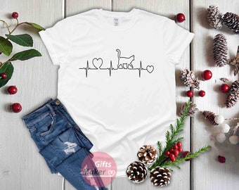 May include: White t-shirt with a black cat silhouette and a heartbeat graphic with two hearts. The graphic reads "My cat's heartbeat"