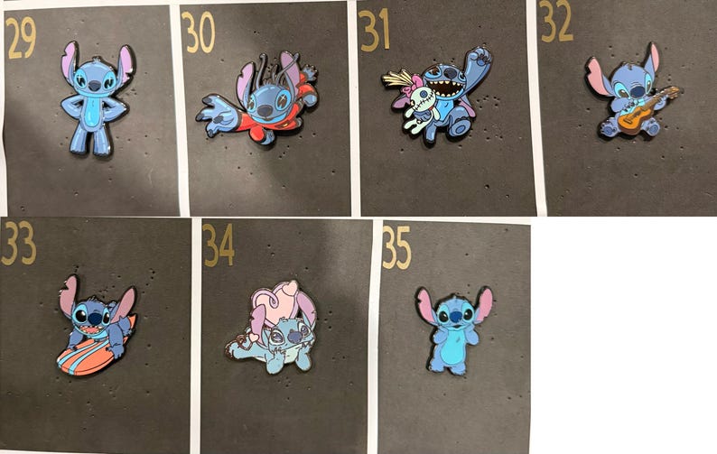 May include: A collection of enamel pins featuring the character Stitch from the animated film Lilo & Stitch. The pins depict Stitch in various poses, including playing a ukulele, surfing, and holding a voodoo doll. The pins are blue, pink, and red.