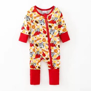 May include: A yellow and red baby sleeper with a zipper closure. The sleeper features a repeating pattern of cartoon dogs, footballs, and the text "Go Chiefs". The cuffs and trim are red.