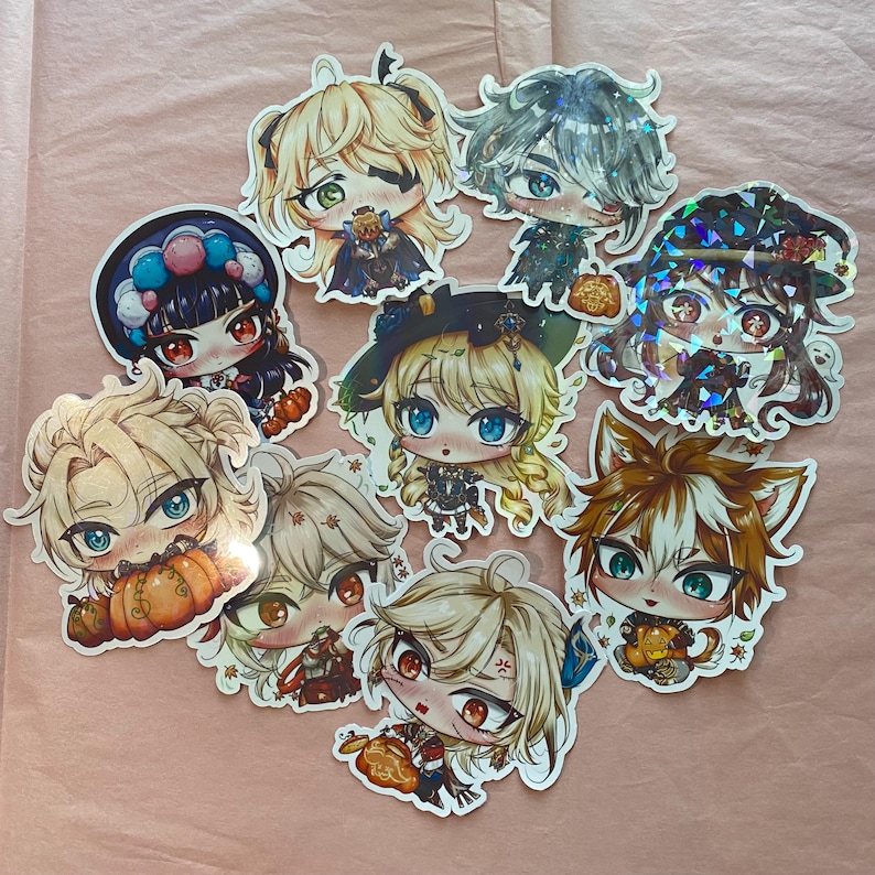 May include: A set of nine colorful anime character stickers featuring various characters with different hairstyles and outfits. The stickers are decorated with fall-themed elements like pumpkins and leaves.