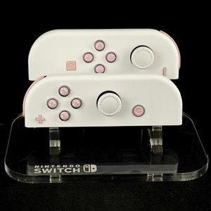 White Nintendo Joycons with Pink Pastel Heart buttons