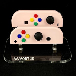 Pastel Pink Nintendo Joycons with rainbow Buttons