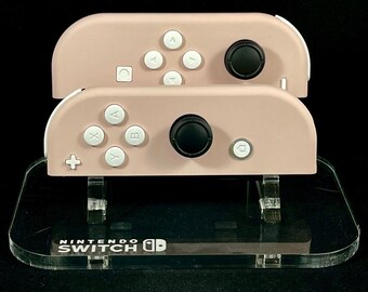 Juego de Joy-Cons de Nintendo Sakura Pink con botones blancos