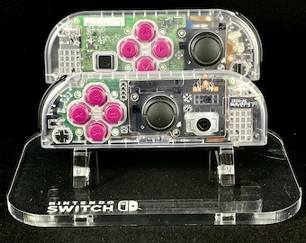 Joy-Cons personalizados transparentes con botones direccionales de color rojo rosado