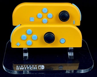 Precaución: Joy-Cons amarillos de Nintendo con botones azul cielo