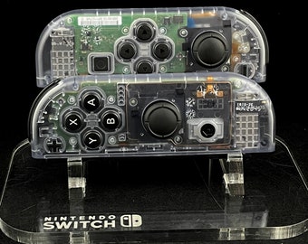 Joy-Cons de Nintendo en azul glaciar transparente con botones negros de fábrica