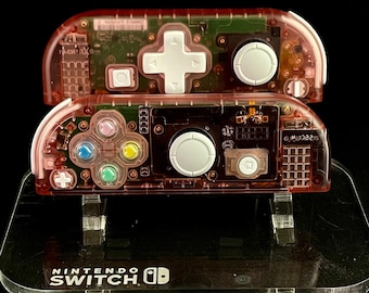 Joy-con Nintendo trasparenti rosa ciliegia personalizzati con cuori arcobaleno e Dpad bianco