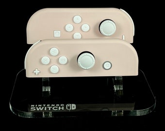 Set Nintendo Joycon rosa Sakura con pulsanti e joystick bianchi
