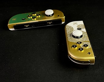 Joy-cons personalizados de Nintendo de Tears of the Kingdom con botones dorados y joysticks blancos