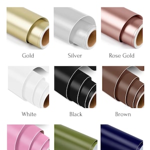 May include: Image showcasing nine color options of rolled vinyl sheets. Colors include gold, silver, rose gold, white, black, brown, pink, olive, and navy. The text "Colour options" is at the top.
