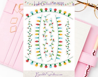 May include: A sheet of stickers featuring various designs of colorful string lights. The stickers are white with a pink outline and the text "Light Garland 50 0028" and "Bandit Stickers.com" are printed on the sheet.