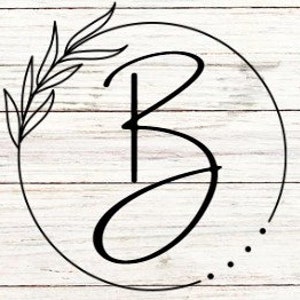 May include: A black and white illustration of the letter "B" in a circle with a leafy branch on the left side. The background is a white woodgrain pattern.