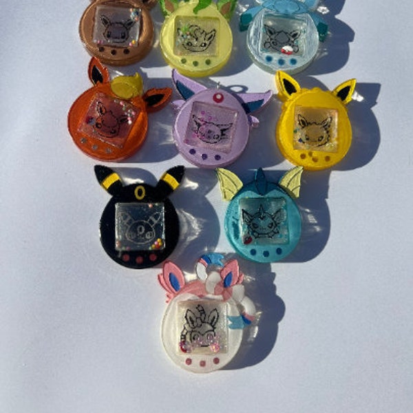 Anime poke eeveelution tomagotchi, keychains, eevee, umbreon, flareon, leafeon, glaceon, vaporeon, espeon, jolteon, sylveon