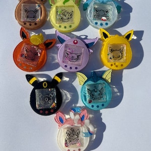 Anime poke eeveelution tomagotchi, keychains, eevee, umbreon, flareon, leafeon, glaceon, vaporeon, espeon, jolteon, sylveon
