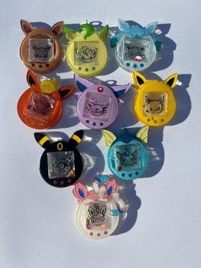 Anime poke eeveelution tomagotchi, keychains, eevee, umbreon, flareon, leafeon, glaceon, vaporeon, espeon, jolteon, sylveon