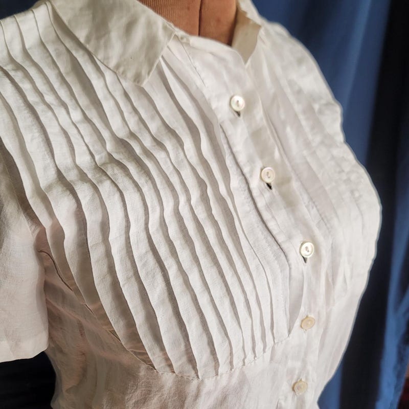 PINTUCK BLOUSE WITH DRAPED SLEEVE BLUSHING MANOR