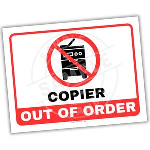 May include: A white rectangular sign with a red border. The sign features a black and white illustration of a copier crossed out by a red circle. Below the illustration, the words "COPIER OUT OF ORDER" are printed in black and red.
