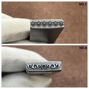 May include: Two metal stamps for leather crafting. The top stamp features a repeating pattern of small, stylized flowers. The bottom stamp features a repeating pattern of stylized, swirling vines.