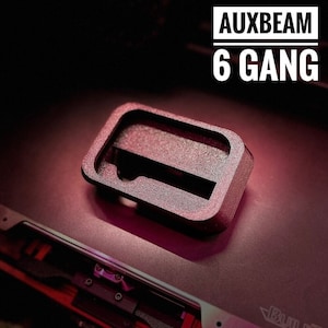 May include: A 3D printed black plastic gear shift knob with the text "AUXBEAM 6 GANG" printed on it.