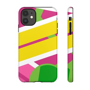 May include: A phone case with a geometric design featuring pink, yellow, green, and white shapes. The case has a black border and a camera cutout.