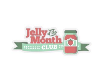 May include: A sticker featuring the text "Jelly of the Month Club" in red and white, with a green banner and a jar of strawberry jelly. The jar has a green lid and a label with a strawberry.