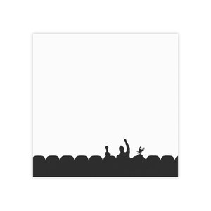 May include: Silhouette of a person raising their hand in a dark theater with a microphone and a spotlight. The person is in front of a row of seats.