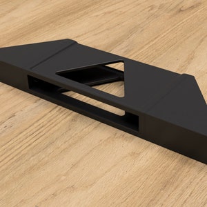 May include: Black metal shelf bracket with a triangular design. The bracket has a rectangular opening in the center.