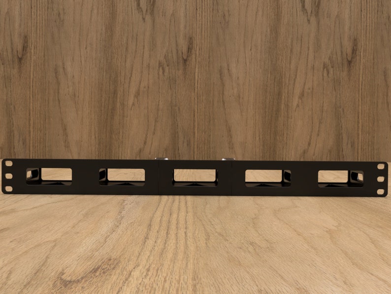 May include: Black metal rack with five rectangular openings. The rack is designed to hold and organize cables or wires.