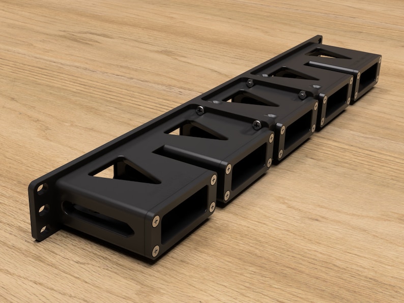 May include: A black metal rack with seven slots for holding items. The rack has a rectangular shape and is made of metal with a black finish.
