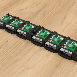 May include: A black metal rack with six green circuit boards mounted on it. The boards have multiple ports and connectors.