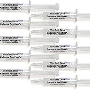 May include: Ten clear plastic syringes filled with a white liquid. Each syringe has the text "White Teeth Global Carbamide Peroxide 44%" printed on the side.