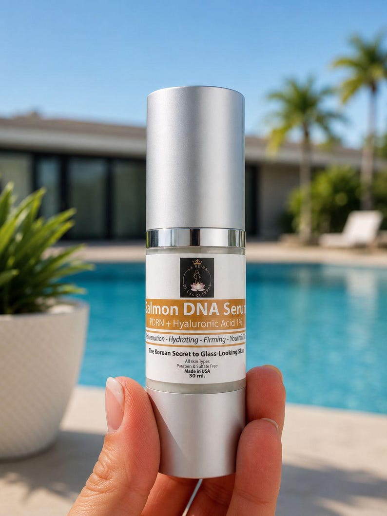 May include: A 30 ml bottle of Salmon DNA Serum with a silver cap and pump dispenser. The white label features the text Salmon DNA Serum, PDRN + Hyaluronic Acid 1%, Rejuvenation-Hydrating-Firming-Youthful, The Korean Secret to Glass-Looking Skin.