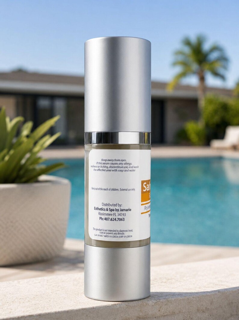 May include: A cylindrical pump bottle with a silver cap and base, containing a beige liquid. The white label features the text 'Distributed by: Esthetics & Spa by Jamarie, Kissimmee FL 34743, Ph: 407.624.7063' along with safety warnings and product information.