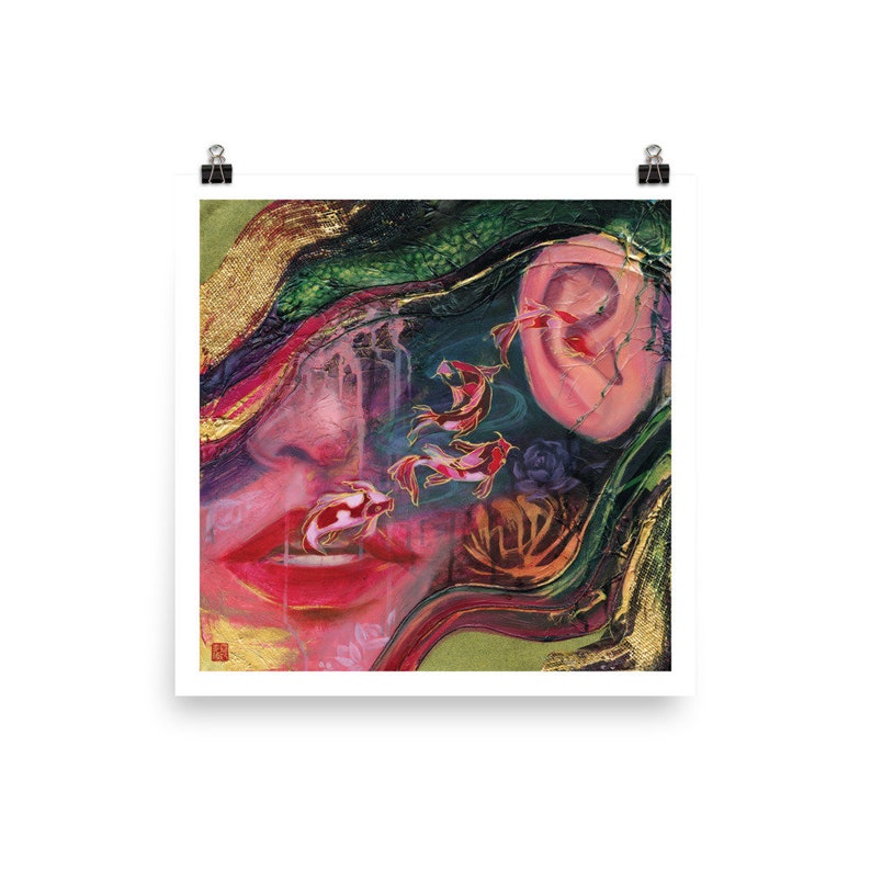 May include: Art print featuring a surrealist composition with a woman's face, koi fish, and an ear. The artwork uses a palette of red, gold, green, and pink. The koi fish are red and white with gold accents, swimming near the woman's lips.