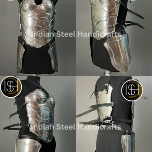 May include: A silver metal breastplate and skirt armor with leather straps. The armor is displayed on a mannequin. The image includes the text "Indian Steel Handicrafts".