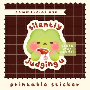 May include: A green cartoon character sticker with the words "silently judging u". The character is holding a cup of tea. The sticker is 10x10 inches and labeled "commercial use" and "printable sticker".