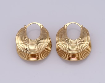 May include: A pair of gold hoop earrings with a textured, layered design. The earrings are circular and have a slightly curved shape.