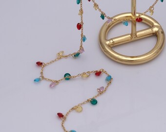 May include: A gold chain necklace with colorful glass beads. The beads are in shades of red, green, blue, and pink.