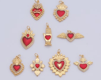May include: A collection of gold-colored pendants with red heart-shaped centers. The pendants feature various designs, including crowns, wings, and hand motifs, and are embellished with clear crystals. These decorative charms are suitable for jewelry making.