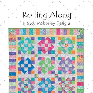 May include: A quilt pattern called "Rolling Along" by Nancy Mahoney Designs. The quilt is made up of colorful squares and rectangles in shades of pink, blue, green, orange, and yellow. The quilt is 44 1/2 inches by 44 1/2 inches and is perfect for precuts.